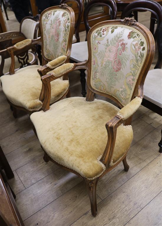 A pair of Louis XV style carved fauteuils